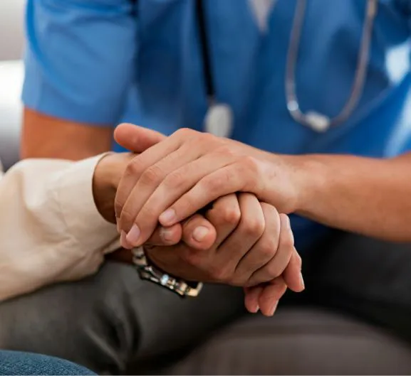 Hands held in a gesture of therapeutic trust and emotional support